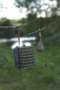 Close-up of clothespins hanging on clothesline