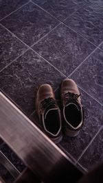 High angle view of shoes on tiled floor