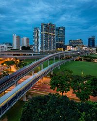 High angle view of bridge and buildings against sky