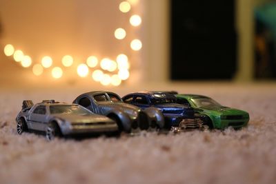 Close-up of toy cars on rug