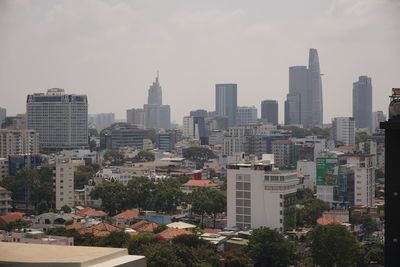 Buildings in city against sky