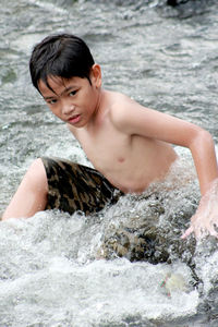 Cute boy in sea