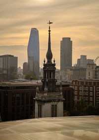 London, uk. tower of the former st. augustine church with skyscrapers in the background.