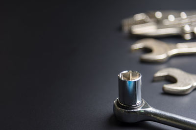 Close-up of work tools on black background