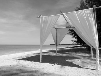 Built structure on beach against sky