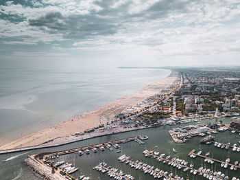 High angle view of city against cloudy sky