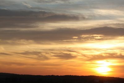 Low angle view of dramatic sky during sunset