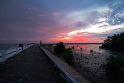 Scenic view of beach against sky during sunset