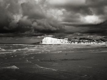 Scenic view of sea against cloudy sky