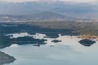 Aerial view of lake with mountains in background