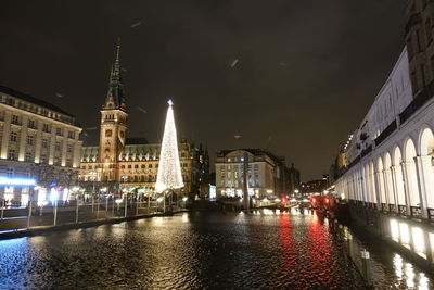 Illuminated city buildings at night