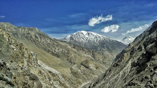 Scenic view of snowcapped mountains against sky