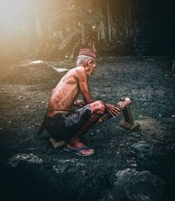 Man sitting in a forest