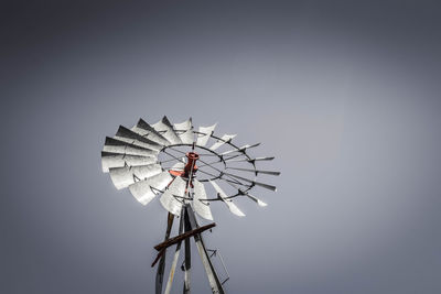 Low angle view of american-style windmill against clear sky