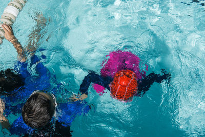 High angle view of boy swimming in pool