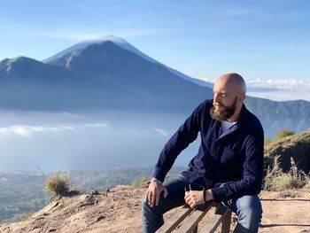 Bearded man on the mountain volcano 