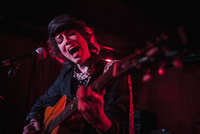 Guitarist performing at a nightclub