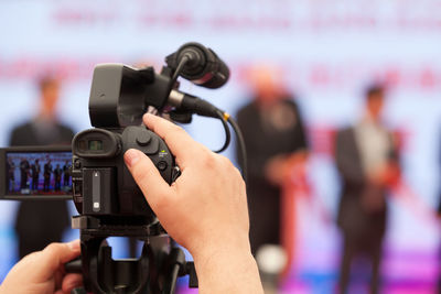 Close-up of hand holding camera