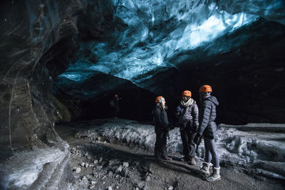 People standing in cave