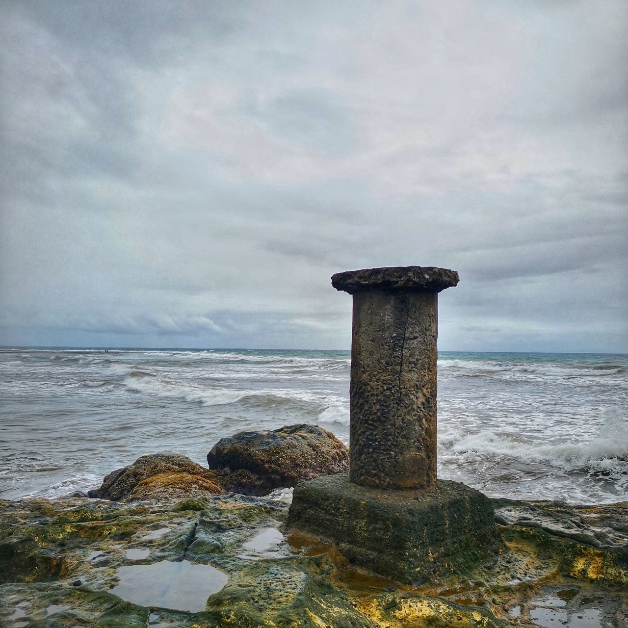 sea, water, tower, coast, rock, sky, ocean, beach, land, cloud, shore, nature, no people, body of water, scenics - nature, beauty in nature, architecture, horizon over water, wave, environment, outdoors, day, horizon, tranquility, lighthouse, guidance, built structure, coastline, tranquil scene, seascape, protection