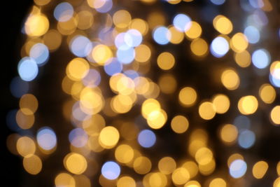 Defocused image of illuminated lights at night