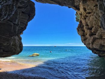 Scenic view of sea against clear blue sky