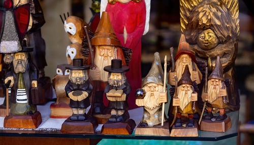 Wood carving handmade mascots on the shop shelf