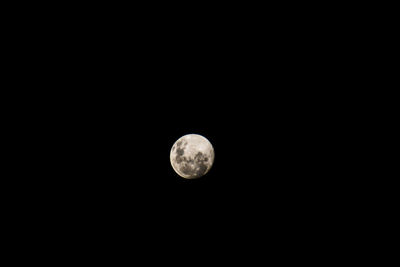 Low angle view of moon against sky at night