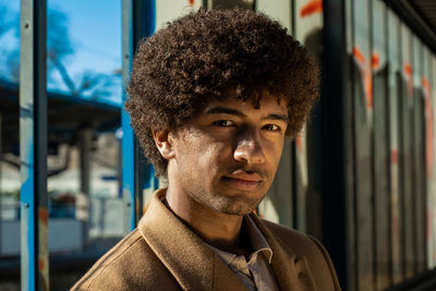 Portrait of young man standing outdoors