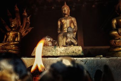 Statue of buddha against building