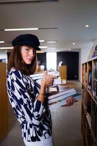 Young woman in the library with books