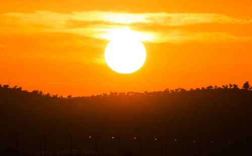 Scenic view of landscape at sunset