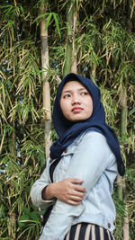 Portrait of teenage girl standing on field