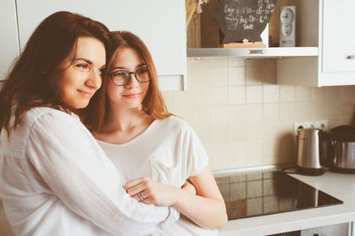 Portrait of beautiful young woman at home