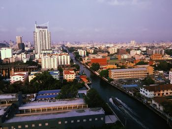 High angle view of buildings in city against sky