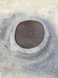 High angle view of manhole on street