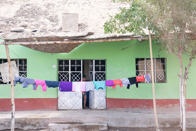 Clothes drying on wall of building