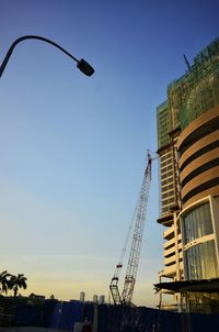 Low angle view of skyscraper against clear sky