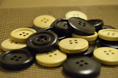 Close-up of buttons on wicker table