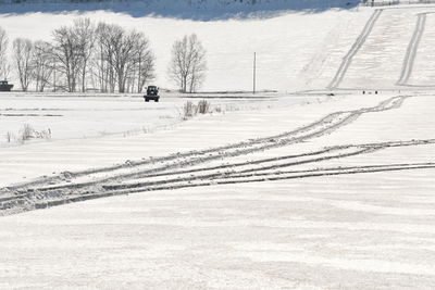 Scenic view of snow covered field