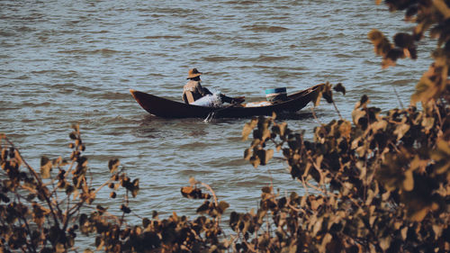 People kayaking on lake