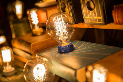 Close-up of illuminated light bulbs in darkroom