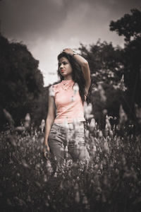 Young woman standing on field