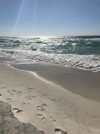 Scenic view of beach against clear sky