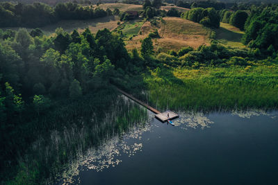 Drone shot of the lake in mazury, poland. wooden pier.