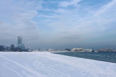 View of buildings against cloudy sky