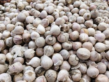 Full frame shot of onions for sale at market