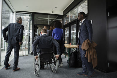 Business professionals entering conference center at convention center