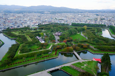 High angle view of buildings in city against sky