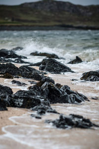 Close-up of rocks in river